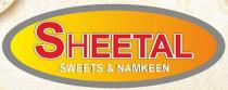 SHEETAL SWEETS & NAMKEEN Written Inside The Oval Shape