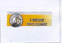 IL MARCHIO VERBALE E FIGURATIVO CONSISTE IN UN CERCHIO CON SFONDO GRIGIO IN CUI E RIPORTATA UNA CASETTA CON SFONDO MARCHIO VERBALE E FIGURATIVO CONSISTE IN UN CERCHIO CON SFONDO GRIGIO IN CUI E RIPORTATA UNA CASETTA CON SFONDO BIANCO. ALL INTERNO DELLA CASETTA VI E RIPORTATO UN AIRONE CON PIUMAGGIO ROSA TENUE CON IL PETTO SUL GIALLO SBIADITO. NELLA PARTE INFERIORE CON IL COLORE VERDE E RIPORTATA UNA PIANTA TIPICA CHE CRESCE PROSPICENTE AI FIUMI SARDI. SUL LATO DESTRO E RIPORTATA LA SCRITTA L AIRONE IMMOBILIARE . SI EVIDENZIA CHE IL MARCHIO PUO ESSERE UTILIZZATO CON TUTTI I COLORI CON LE LORO TONALITA E CON TUTTI I CARATTERI DI STAMPA POSSIBILI. IL MARCHIO VERBALE E FIGURATIVO CONSISTE IN UN CERCHIO CON SFONDO GRIGIO IN CUI E RIPORTATA UNA CASETTA CON SFONDO