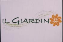 IL GIARDINO CON UNA FLOR AL FINAL DE LA PALABRA HACIENDO ALUCION A LA LETRA O