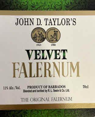 JOHN D. TAYLOR'S 1923 1980 VELVET FALERNUM 11% ALC./VOL. PRODUCT OF BARBADOS 70CL BLENDED AND BOTTLED BY R. L. SEALE & CO. LTD. THE ORIGINAL FALERNUM